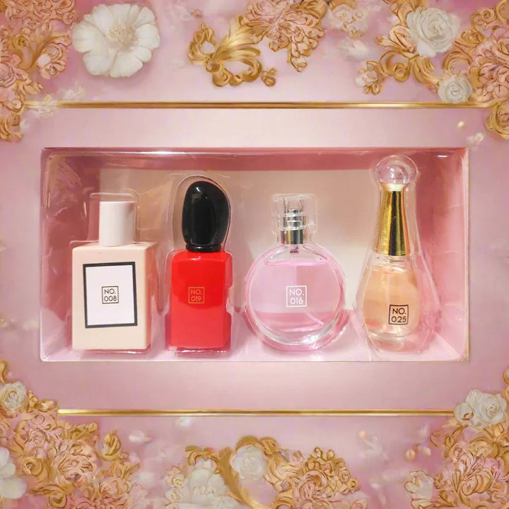 Set of four perfume bottles in a clear plastic case on a white background